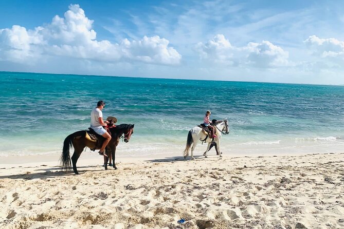 60-Minute Private Horseback Riding Experience in Turks and Caicos - Beach riding, shallow water, and the photo issue