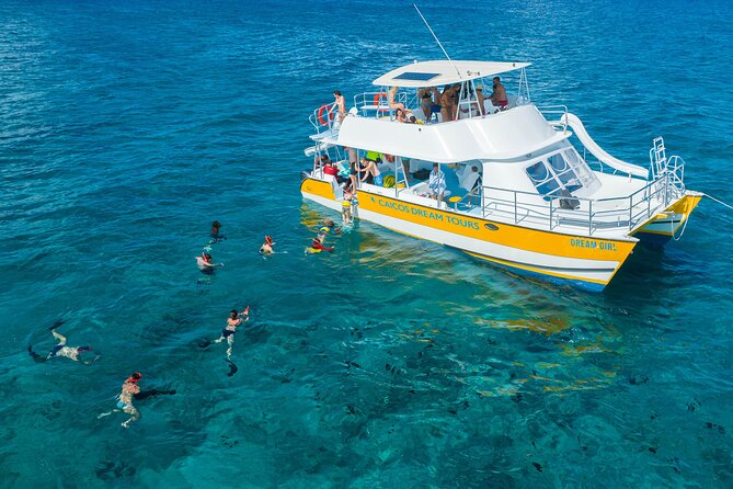 Afternoon Half Day Cruise from Providenciales with Snorkeling and Iguana Island - Lunch arrives onboard, along with rum punch and beer