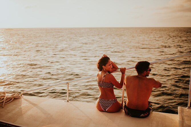 Aruba Morning Snorkeling or Sunset Sail to Boca Catalina With BBQ - The meal, open bar, and onboard atmosphere