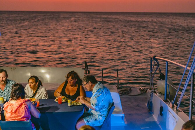 Aruba Sunset Sail Dinner Cruise with Open Bar by Catamaran - Music, conversation, and a dance floor after dark