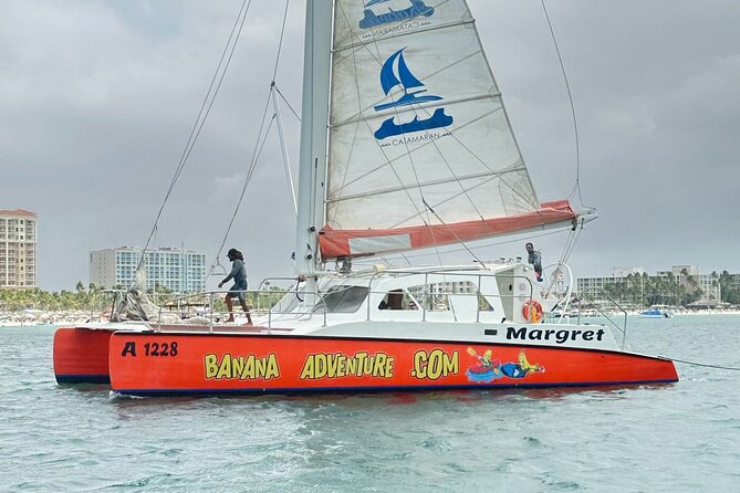 Banana Adventure Catamaran Tropical Sunset Sail - Along the hotel strip and toward Oranjestad harbor