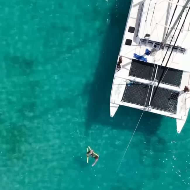 Barbados: Catamaran Tour with Snorkeling and Lunch - Beach time, music, and the return sail