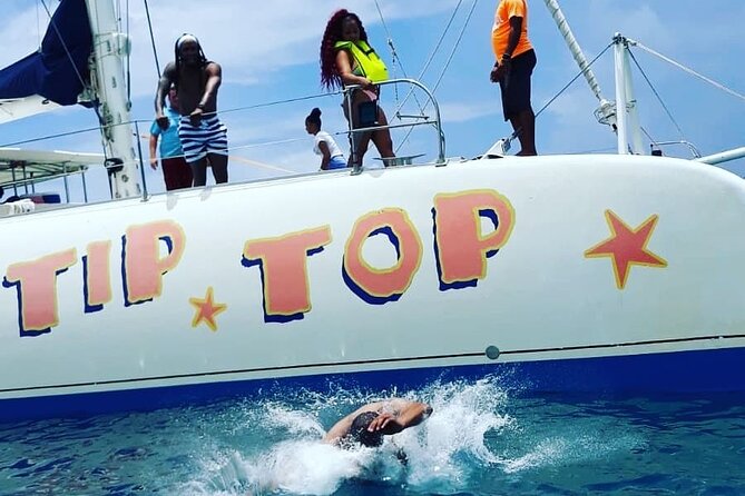 Catamaran Day Trip, Snorkeling & Sailing Excursion - Boarding the 75-foot TipTop catamaran