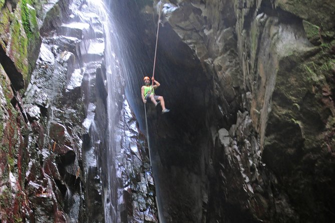 Full-Day Zipline and Waterfall Rappelling Adventure Near San Juan - The river hike is half the adventure