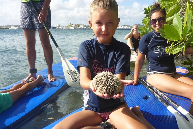 Guided paddleboarding (SUP) mangrove ECO tour for beginners - The open-water return past the villas