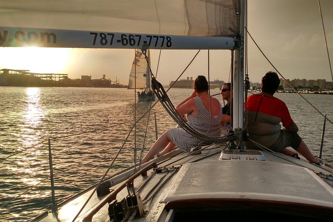 Historical San Juan Bay Sunset Sailing Tour - A small sailboat with a big San Juan view