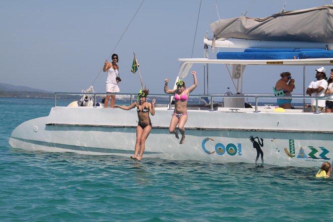 Jamaica Dunn's River Falls Party Cruise with Snorkeling - Mahogany Beach sets the tone with Jamaican food