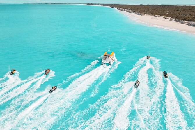 Jet Skiing around La famille ship and smaller pristine cays - Riding out from Leeward to La Famille Express