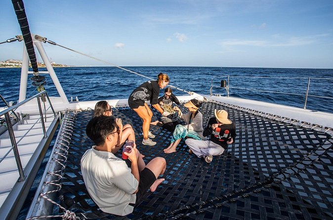 Klein Curacao Sunset Cruise with Open Bar and BBQ - Returning along Curacao’s east coast at sunset