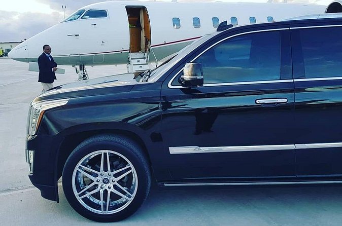 Luxury Escalade Cadillac Private Roundtrip Transportation - Comfort, water, and service details