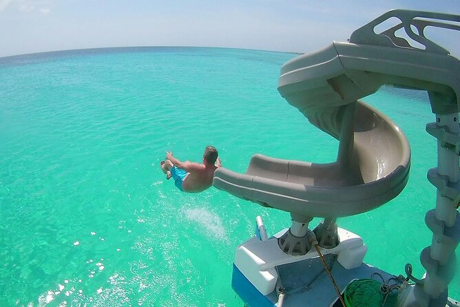 Private Catamaran Adventure Cruise with Rope Swing and Water Slide - Rope swing and spinning water slide turn the boat into a playground