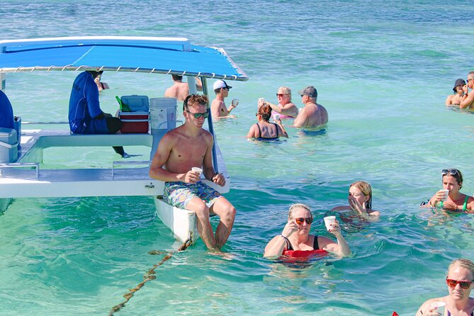 Punta Cana Exclusive Adults-Only Snorkel with Food and Drinks - The palm-lined beach and the Cocoloco drink