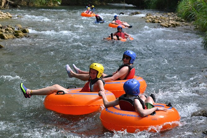 River Rapids Waterfalls Tubing and Beach Adventure with Transport - Rio Bueno tubing, from calm current to small rapids