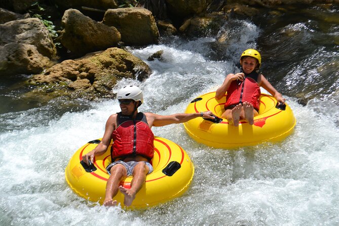 River Rapids Waterfalls Tubing and Beach Adventure with Transport - Bamboo shade, a rope swing, and a break in the river