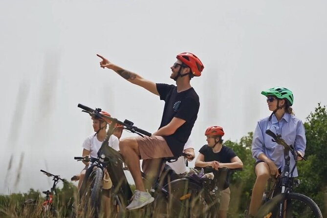 Small Group E-Bike Grand Cayman Ecological Half-Day Tour - Seven Mile Beach starts the ride with views and island context