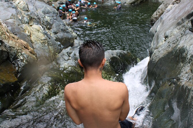 Small-Group El Yunque Waterslide Adventure & transportation - Natural waterslides, rope swings, and cliff jumps