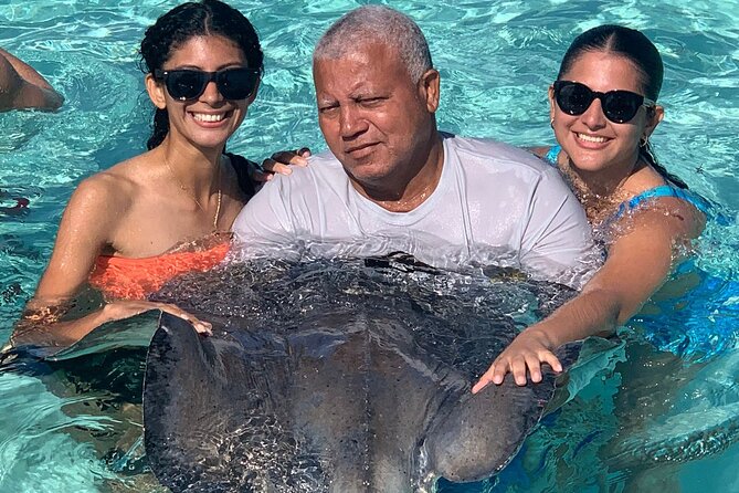 StingrayCity ,Coral Garden & Starfish Tour. - Wading among starfish at Starfish Pointe