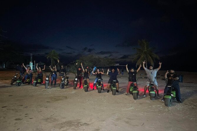 Sunset Island Tour in Aruba on Electric Scooter (1 or 2-seater) - Palm Beach shows the island after dark begins