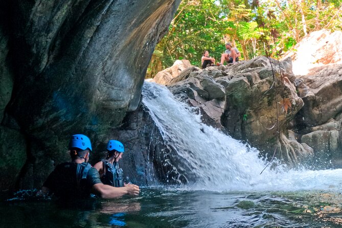Two-in-One Day Trip: El Yunque and Bio Bay Tour with Transport - Entering El Yunque through mud, plants, and river rock